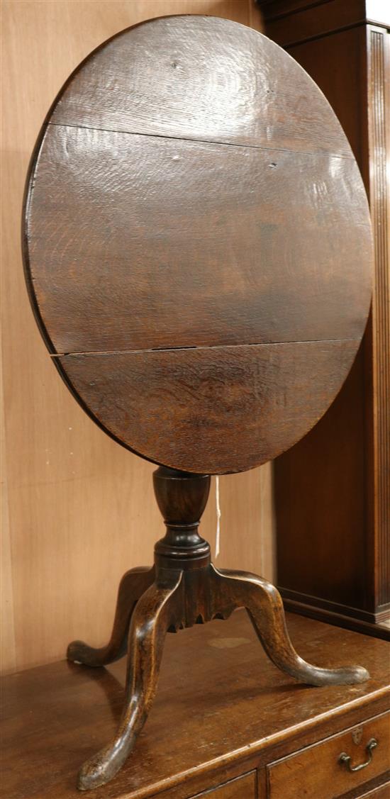 A George III oak tripod table, W.71cm